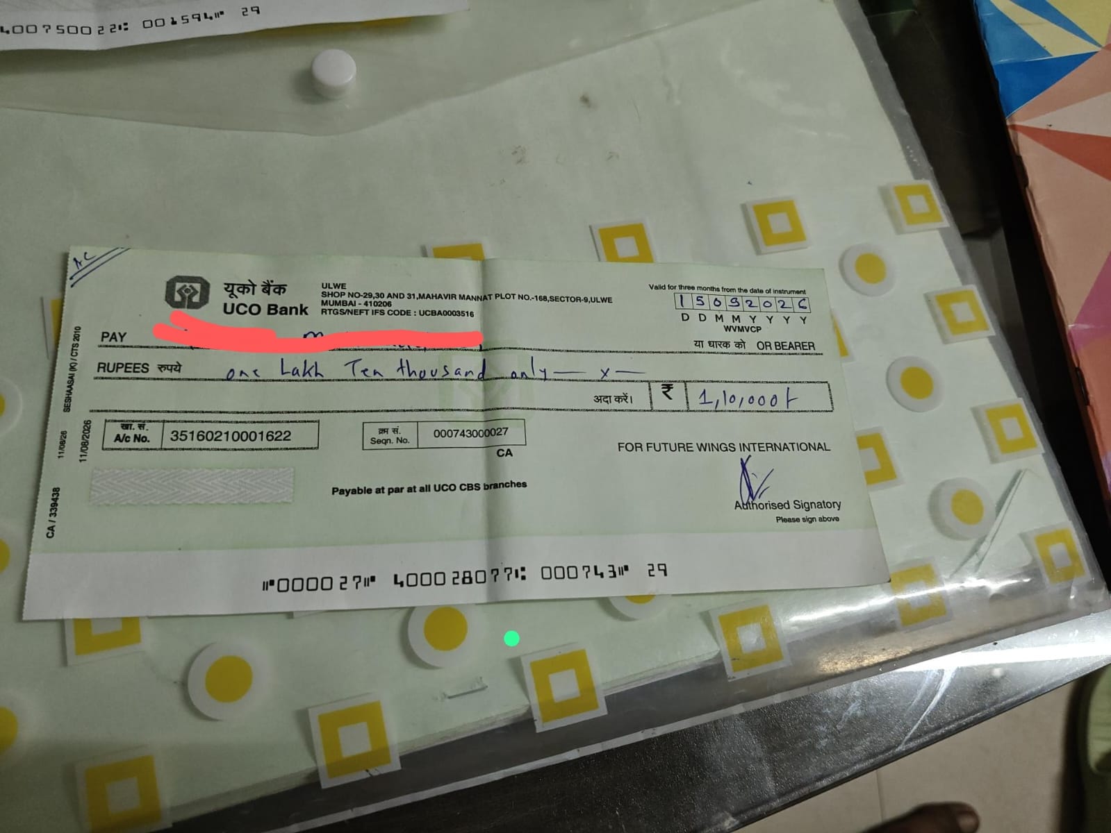 Post-dated cheque for 1 lakh 10 thousand rupees drawn on Future Wings International at UCO Bank Ulwe